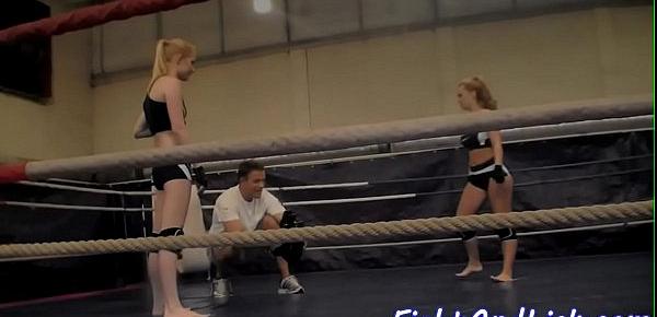  Muscular women wrestling in a boxing ring